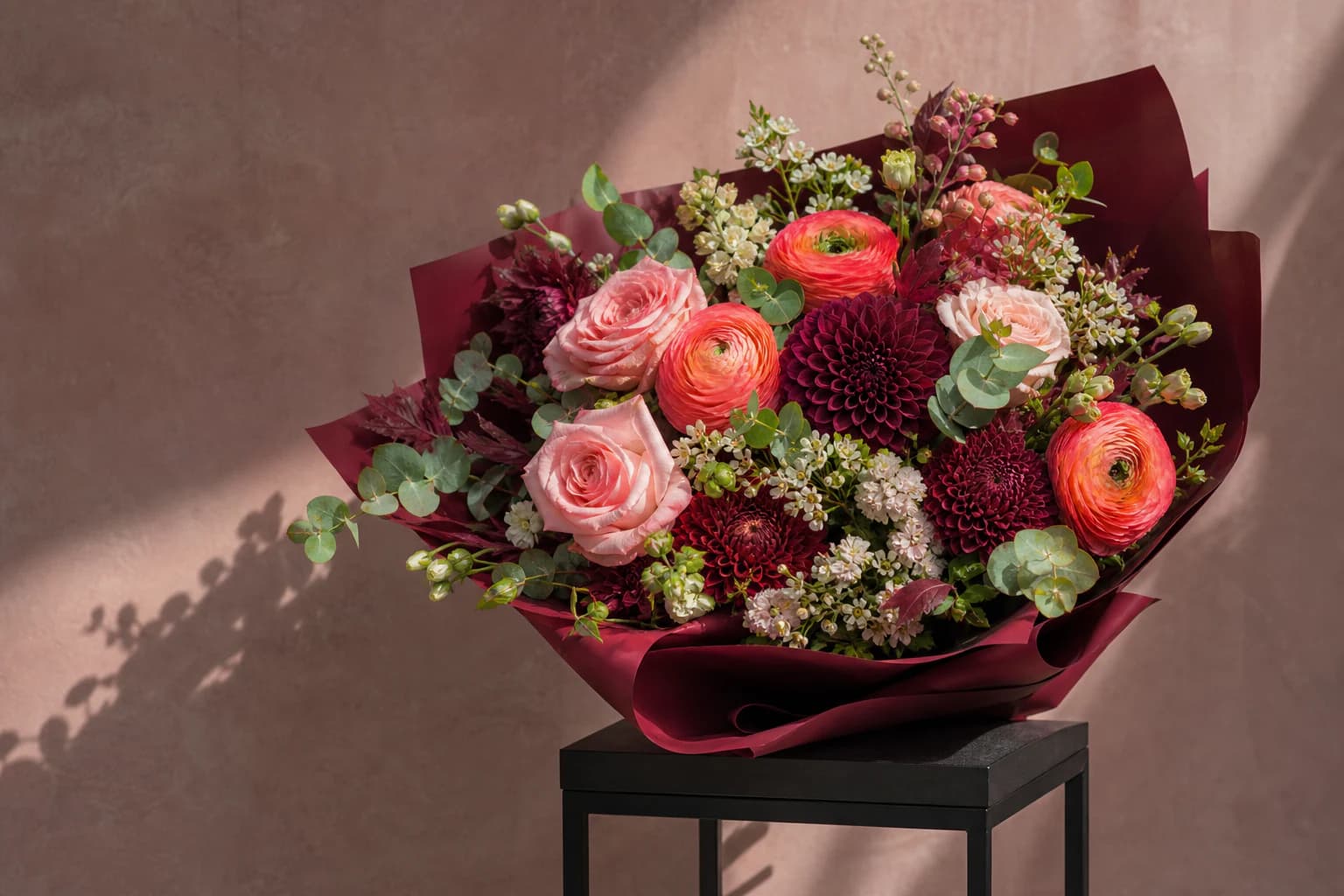 Coral and burgundy mixed-flower bouquet